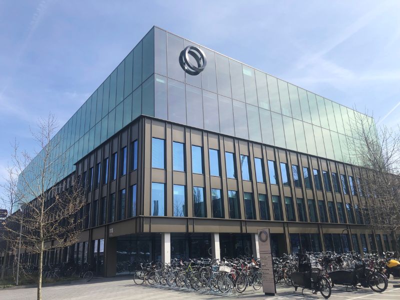 An image of The Edge, Amsterdam, Netherlands. It is an entirely glazed building with little wall surface area that is not glass.