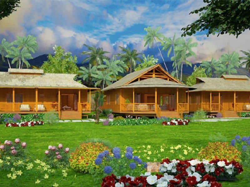 The Pacific Villa by Bamboo Living. This building comprises a row of single-story homes with covered porches. The image shows the villa set in green grounds with palm trees behind.