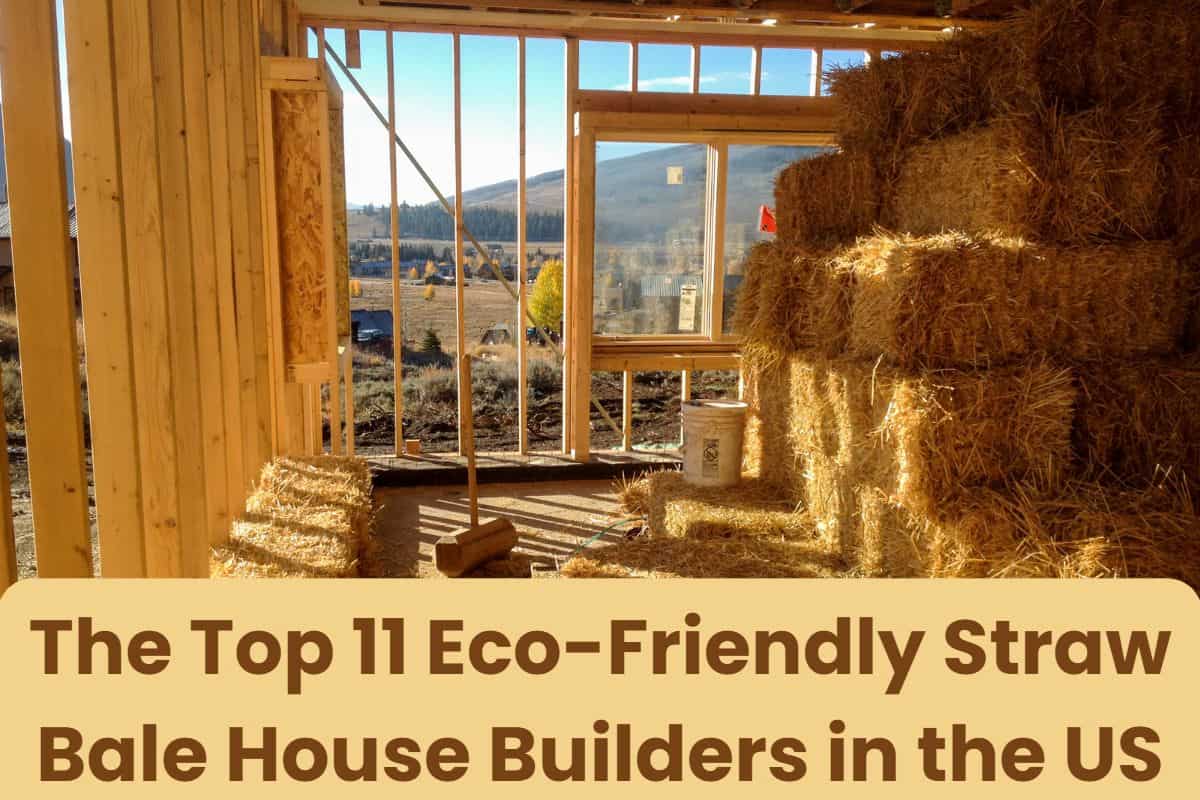 A photograph of a straw bale house under construction. The photo is taken from the inside of the building, looking through the wooden frame towards a rural countryside. There is a stack of straw bales in the building. The words "The Top 11 Eco-Friendly Straw Bale House Builders in the US" are written across the bottom of the image.