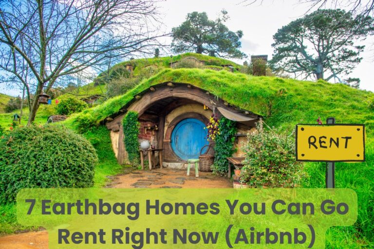 A hobbit house built into a lush green hill with a round blue door and a stone path leading up to the front. Across the bottom of the image are the words "7 Earthbag Homes You Can Go Rent Right Now (Airbnb)." There is a "Rent" sign outside.