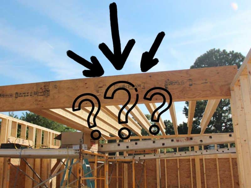 An LVL beam with arrows above and question marks below. The beam forms part of the structure of a house, which is only partly built.