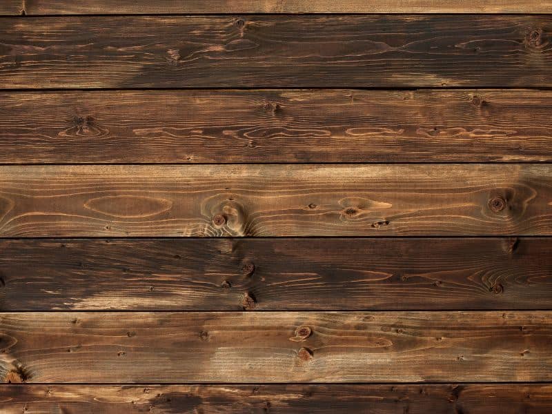 A reclaimed wood ceiling with beautiful grain patterns and knots.