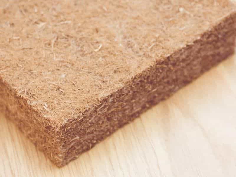 A hemp insulation batt. It is dark brown and the fibers can clearly be seen in the material.