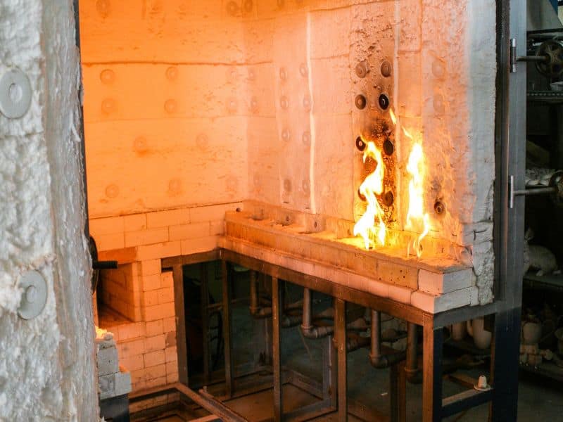 An industrial kiln ready to be loaded with wood for treatment.