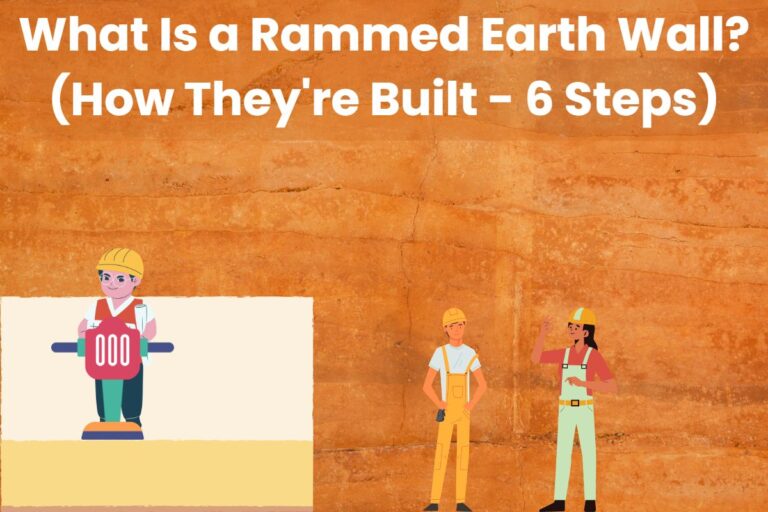 A rammed earth wall with cartoon builders overlain. The builder on the left uses a ram to compact the earth in a cartoon rammed earth wall. Across the top are the words "What Is a Rammed Earth Wall? (How They're Built - 6 Steps)"