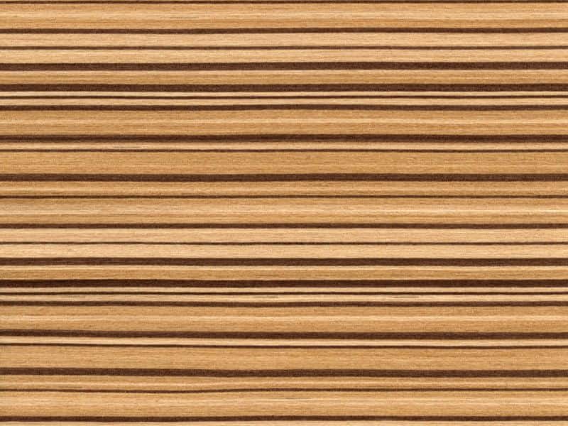 A closeup photograph of a zebra wood countertop. The grain has beautiful dark stripes interspersed with lighter sections.