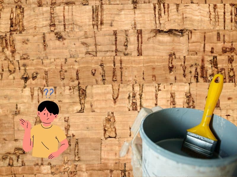 A photograph of a paint pot and paintbrush with a cork background. In the lower-left corner is a cartoon man with question marks over his head.