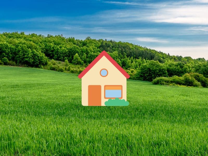 A cartoon cob house overlain across a photograph of a green grassy field with trees in the background.