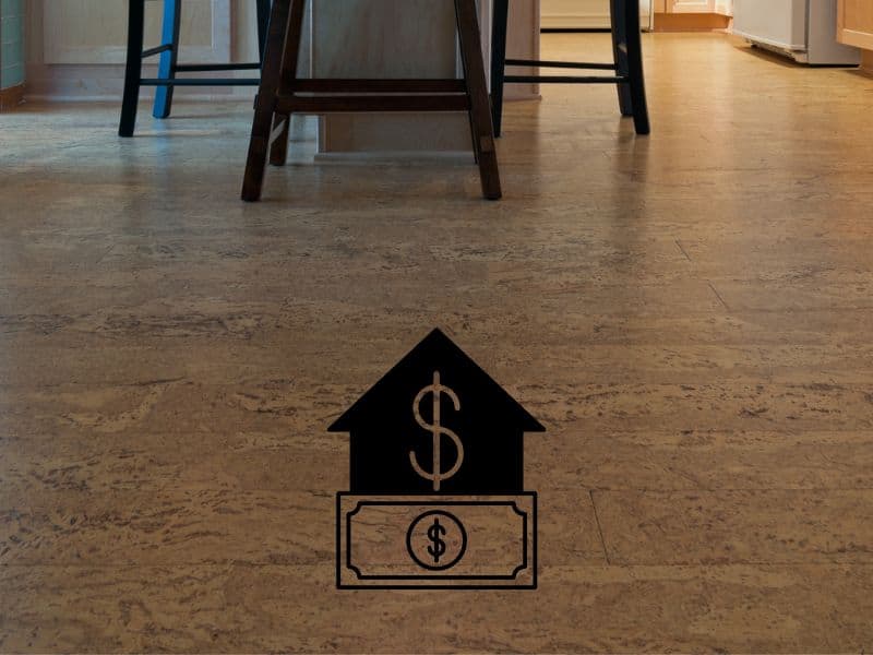 A beautiful cork floor in a dining room with a cartoon graphic overlain with a dollar bill with a large upwards arrow above it indicating high cost.