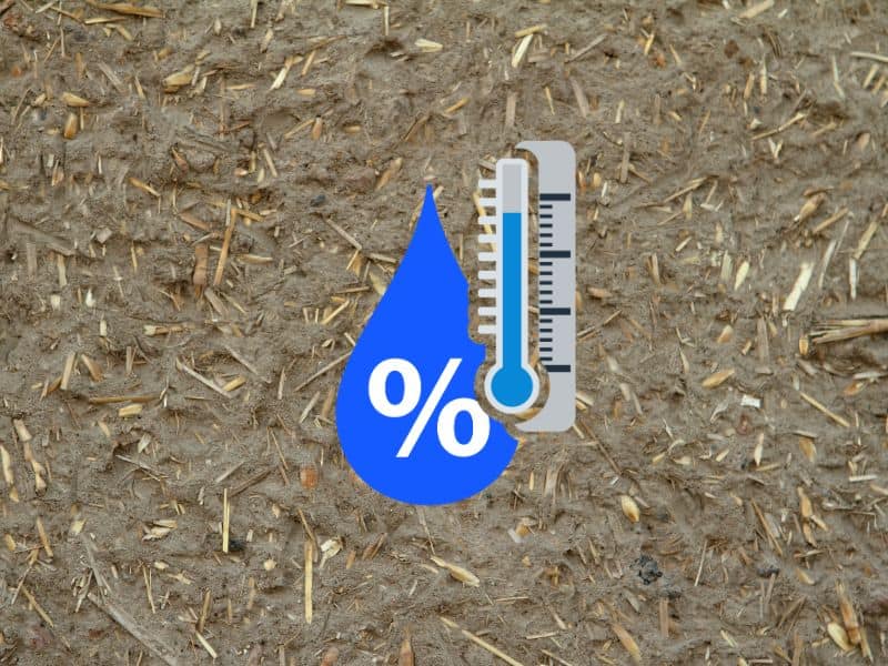 A photograph of a cob wall with pieces of straw visible at the surface. Overlain is an icon of a water droplet with a percentage symbol and a thermometer to indicate humidity and temperature.