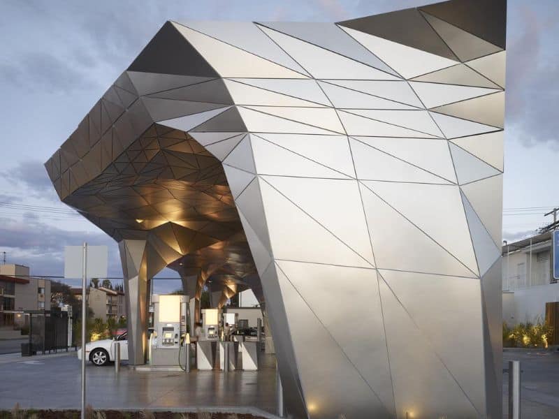 A futuristic-looking gas station called Helios House incorporates lots of interesting angles formed with recycled steel.