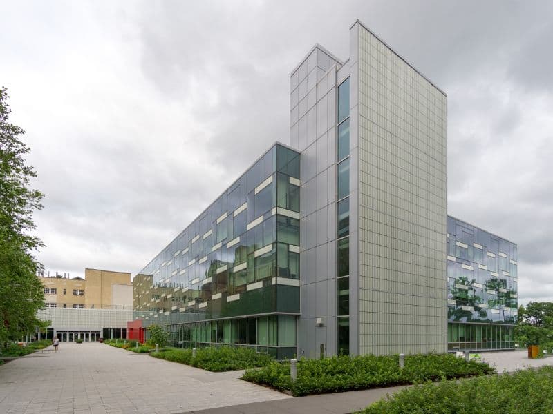 A photograph of the Human Ecology Building at Cornell University with its striking glass frontage.